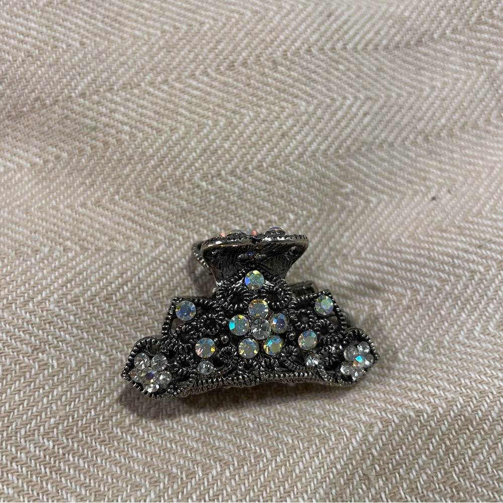 Antique silver hair clip with diamonds.